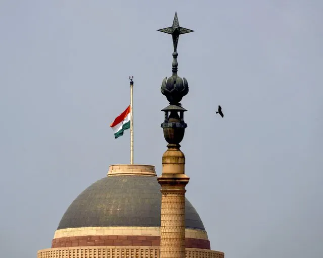 The Indian flag flies at half-mast at the Indian Presidential Palace following Thursday’s death of Britain's Queen Elizabeth II in New Delhi, India, Sunday, September 11, 2022. (Photo by Manish Swarup/AP Photo)