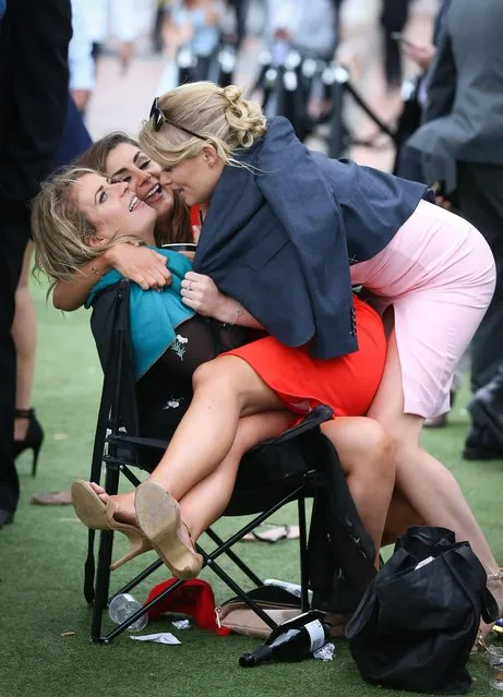 This group engage in a bit of horse play during Caulfield Cup Day at Caulfield Racecourse on October 21, 2017 in Melbourne, Australia. (Photo by Splash News and Pictures)