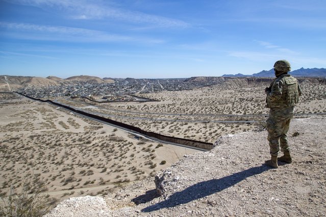 An Army soldier looks at the border wall while providing security to the visit of Defense Secretary Pete Hegseth to the US-Mexico border in Sunland Park, N.M., Monday, February 3, 2025. (Photo by Andres Leighton/AP Photo)
