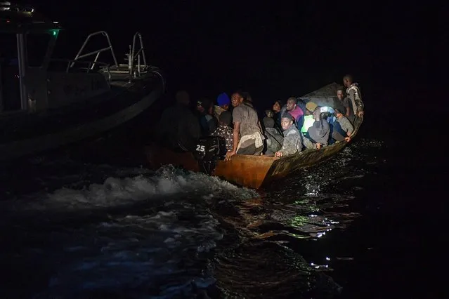 Migrants from sub-Saharan Africa are found late at night by the Tunisian National Guard at sea about 50 nautical miles in the Mediterranean sea off the coast of Tunisia's central city of Sfax on October 4, 2022. (Photo by Fethi Belaid/AFP Photo)