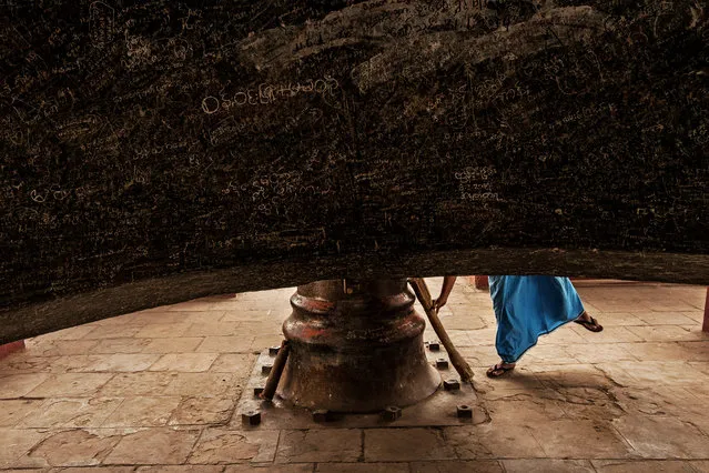 “Mingun bell”. A buddhist man is gonna play the Mingun bell, the biggest suspended and working bell in the world. Photo location: Mingun, Myanmar. (Photo and caption by Michele Martinelli/National Geographic Photo Contest)