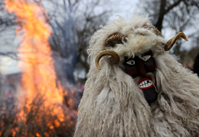 A reveller wears a mask during the traditional Buso Carnival in Mohacs, Hungary, on February 11, 2024. (Photo by Bernadett Szabo/Reuters)