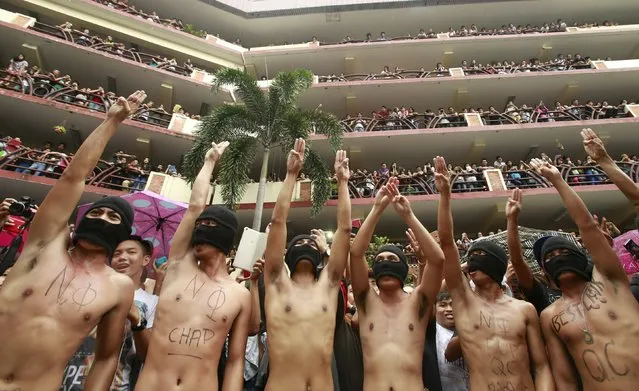 Naked student members of the Alpha Phi Omega fraternity gesture during the annual Pylon Run at the Polytechnic University of the Philippines (PUP) in Manila October 1, 2015. (Photo by Romeo Ranoco/Reuters)