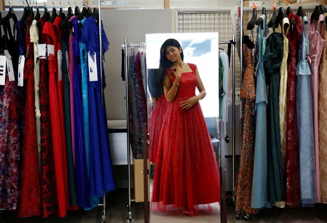 Priyanka Yoshikawa, winner of Miss World Japan 2016, looks at herself in the mirror as she chooses a dress which she is going to wear in the Miss World competition, at a designer's atelier in Tokyo, Japan, September 7, 2016. (Photo by Kim Kyung-Hoon/Reuters)