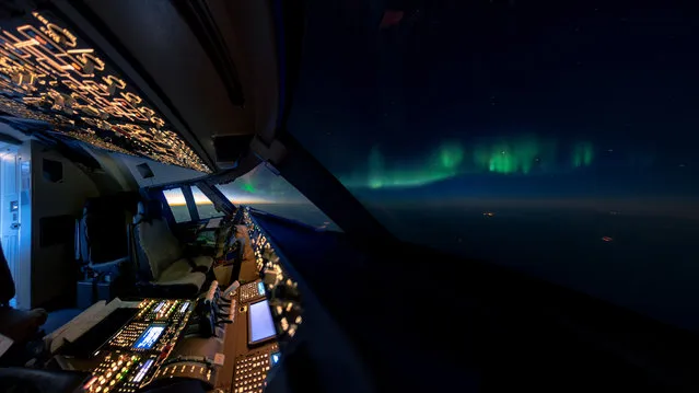 The Boeing 747-8 cargo plane pilot has seen thunderstorms, shooting stars and sunsets from up above the clouds and has looked down on mountaintops, carpets of cloud and cities lit up at night. The incredible pictures give a glimpse of the view from the pilots are treated to every day. Van Heijst, 34, from Haarlem in the Netherlands, said: “All photos together create a much bigger picture of what it’s like to fly high up in the empty skies, an isolated vastness where humans or animals naturally have no place to be. One of the fascinating aspects of flying for me is being in this vast and nearly empty world that is completely alien for human beings and can only be seen and experienced when flying a modern airplane. There is a powerful and peaceful sense of solitude about it while sitting in a small cockpit, 38,000 feet up in the sky with a vista that extends thousands of miles from horizon to horizon and not another human being close for hundreds of miles, except my colleague, of course. Views that are unique and never to be seen again, I just feel I have to capture and share them, before they are gone for good”. Here: An aurora seen from the cockpit. (Photo by Christiaan van Heijst/Caters News Agency)
