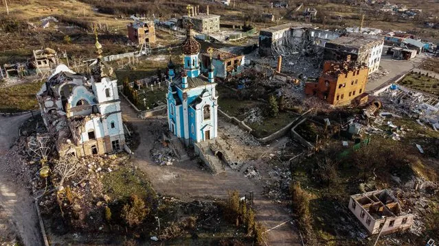 This aerial photograph taken on December 20, 2022, shows destruction in the village of Bohorodychne, eastern Ukraine. Bohorodychne is a village in Donetsk region that came under heavy attack by Russian forces in June 2022, during the Russian invasion of Ukraine. On August 17, 2022 the Russian forces captured the village. The Armed Forces of Ukraine announced on September 12, 2022 that they took back the control over the village. A few resident came back to restore their destroyed houses and live in the village. (Photo by Ionut Iordachescu/AFP Photo)