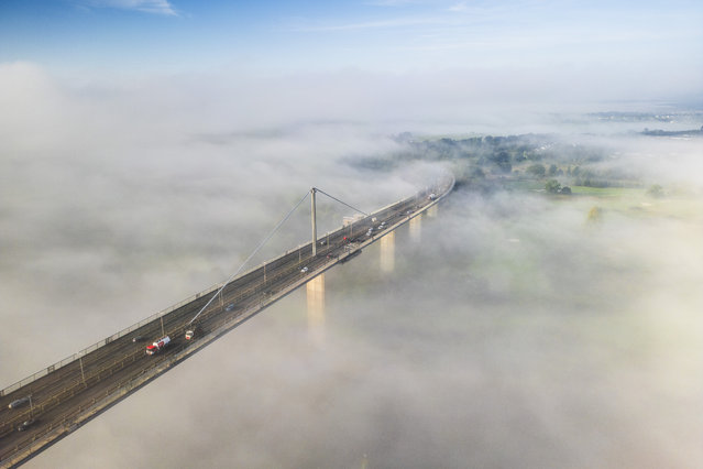 Commuters travelling over the Erskine Bridge in Renfrewshire Scotland on September 18, 2024 as it rises out of the early morning fog. (Photo by Jamie Williamson/The Times)