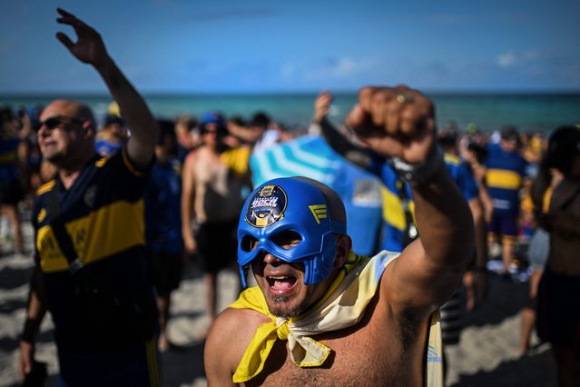 A Boca Juniors fan cheers at Miami Beach, Florida on June 19, 2025, on the eve of the FIFA Club World Cup 2025 football match between Germany's Bayern Munich and Argentina's Boca Juniors. (Photo by Patricia de Melo Moreira/AFP Photo)
