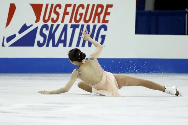Wang Xuehan of China falls during her performance with compatriot Wang Lei during the pairs free skate program at the Skate America figure skating competition in Milwaukee, Wisconsin October 24, 2015. (Photo by Lucy Nicholson/Reuters)