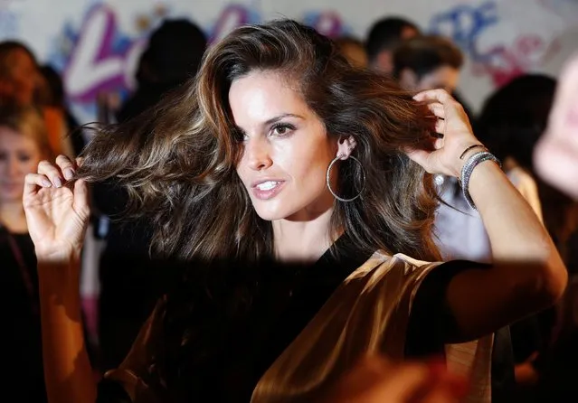 Model Alessandra Ambrosio prepares ahead of the 2014 Victoria's Secret Fashion Show in London December 2, 2014. (Photo by Suzanne Plunkett/Reuters)