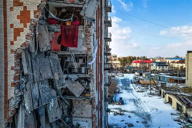 This aerial photograph shows a damaged residential building in the town of Lyman, Donetsk region, on February 22, 2023, amid Russia's military invasion on Ukraine. (Photo by Ihor Tkachov/AFP Photo)