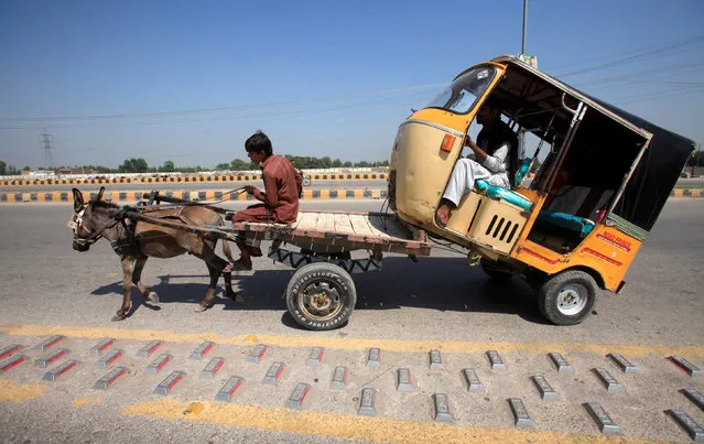  A rickshaw is towed to a workshop for repair on a donkey cart outside Peshawar, Pakistan September 17, 2016. (Photo by Fayaz Aziz/Reuters)