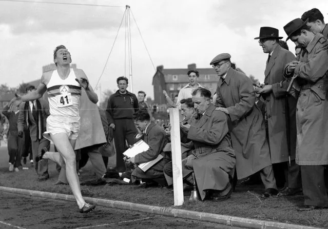 In this May 6, 1954 file photo, Britain's Roger Bannister hits the tape to become the first person to break the four-minute mile in Oxford, England. A statement released Sunday March 4, 2018, on behalf of Bannister's family said Sir Roger Bannister died peacefully in Oxford on March 3, aged 88. (Photo by AP Photo)
