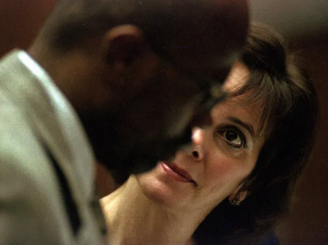 Marcia Clark huddles with co-prosecutor Christopher Darden during arguments about defense exhibits in the O.J. Simpson murder case in Los Angeles Friday morning, September 8, 1995. Prosecutors filed an emergency appeal to stop Judge Lance Ito from telling jurors that retired Detective Mark Fuhrman's “unavailability” to testify can be considered when weighing his credibility as a witness. (Photo by Eric Draper/AP Photo)