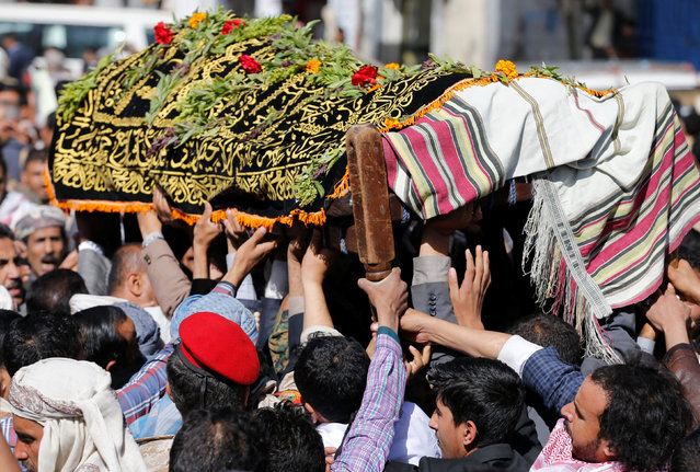 Mourners carry the coffin of Abdul Qader Helal, the mayor of Sanaa, the capital of Yemen, who was killed by an apparent Saudi-led air strike that ripped through a wake attended by some of the country's top political and security officials in Sanaa, October 10, 2016. (Photo by Khaled Abdullah/Reuters)