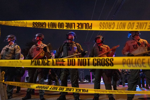 Police face off with demonstrators following the close of the “Free Speech Zone” near the immigrant processing and detention centre in Illinois on October 18, 2025. Demonstrations have been taking place outside of the facility for several weeks as the Trump administration’s Operation Midway Blitz has been under way, arresting and detaining immigrants in the Chicago area. (Photo by Scott Olson/Getty Images)