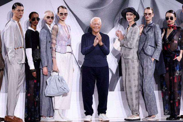 Designer Giorgio Armani stands next to models during the Emporio Armani Spring/Summer 2025 collection at the Fashion Week in Milan, Italy, on September 19, 2024. (Photo by Claudia Greco/Reuters)