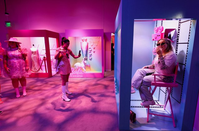 People take pictures in Barbie's box during the World of Barbie immersive experience preview in Santa Monica, California, U.S., April 12, 2023. (Photo by Mario Anzuoni/Reuters)