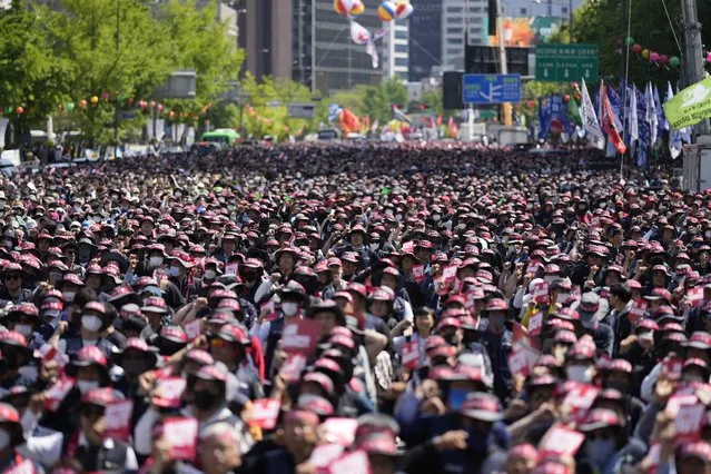 Members of the Korean Confederation of Trade Unions shout slogans during a rally on May Day in Seoul, South Korea, Monday, May 1, 2023. A large number of workers and activists in Asian countries are set to mark May Day on Monday with protests calling for higher salaries and better working conditions, among other demands. (Photo by Lee Jin-man/AP Photo)