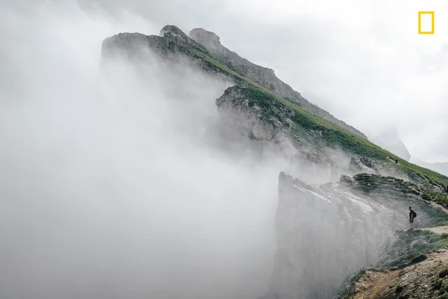 “Sea of Clouds”. “Hiking in South Tyrol is a one-of-a-kind experience. It was the first time I was walking so close to the edge of a mountain, almost surrounded by clouds. Nature’s power in these situations reminds us that we’re only guests on this planet”. (Photo by Guillaume Flandre/National Geographic Travel Photographer of the Year Contest)