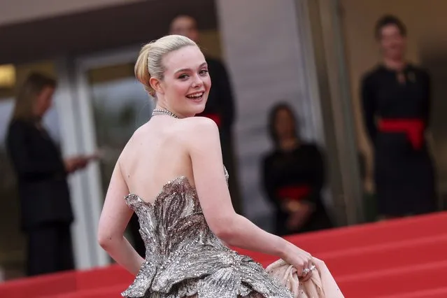 American actress Elle Fanning poses for photographers upon arrival at the opening ceremony and the premiere of the film “Jeanne du Barry” at the 76th international film festival, Cannes, southern France, Tuesday, May 16, 2023. (Photo by Vianney Le Caer/Invision/AP Photo)