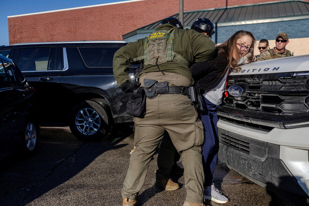 U.S. federal agents detain a rapid responder during an immigration raid, after U.S. President Donald Trump ordered increased federal law enforcement presence to assist in crime prevention, in Chicago, Illinois, U.S., December 17, 2025. (Photo by Jim Vondruska/Reuters)