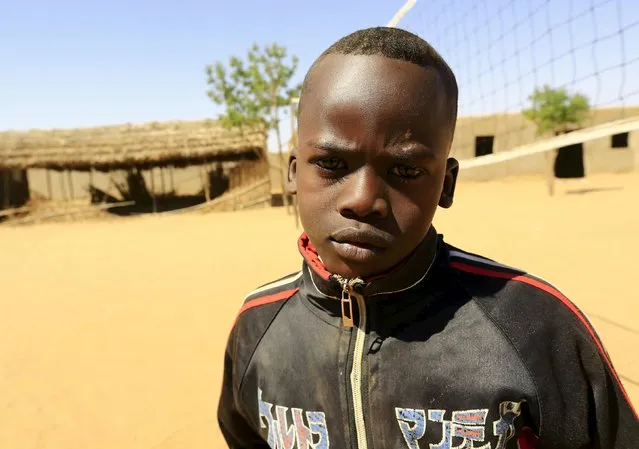 Yousif Abdu Al Rahman poses for a photograph in Aboshouk camp in Darfur, Sudan, November 17, 2015. Born in the camp, 12-year-old Yousif wishes to be an engineer or a journalist in his adulthood. (Photo by Mohamed Nureldin Abdallah/Reuters)