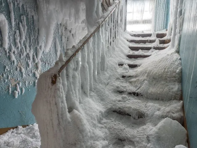 An inside view from snow and ice covered abandoned building in Severny region, 17 kilometers from coal-mining town Vorkuta, Komi Republic, Russia on March 01, 2021. (Photo by Maria Passer/Anadolu Agency via Getty Images)