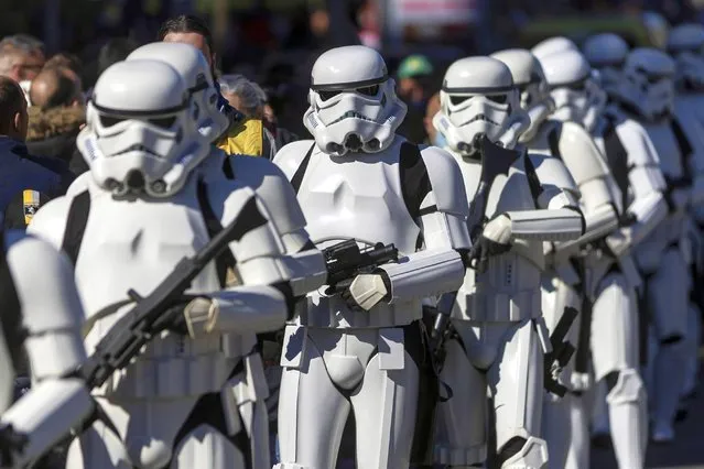 Star Wars fans disguised as stormtroopers take part in the Galaxy Day Parade in Madrid, Spain, 03 April 2022. The event is organized by Star Wars fan clubs in support of social associations focused on mental illness and functional diversity. (Photo by Rodrigo Jimenez/EPA/EFE)