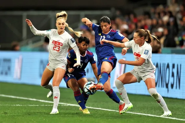 Alicia Barker of Philippines competes for the ball against Alisha Lehmann and Noelle Maritz of Switzerland during the FIFA Women's World Cup Australia & New Zealand 2023 Group A match between Philippines and Switzerland at Dunedin Stadium on July 21, 2023 in Dunedin, New Zealand. (Photo by Lars Baron/Getty Images)