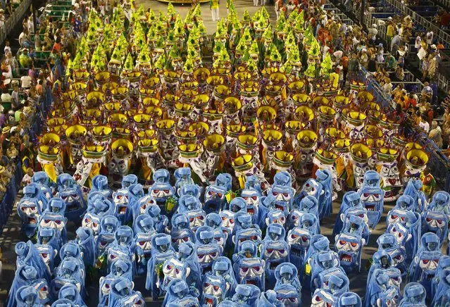 Revellers from the Grande Rio samba school participate in the annual carnival parade in Rio de Janeiro's Sambadrome, February 16, 2015. (Photo by Ricardo Moraes/Reuters)