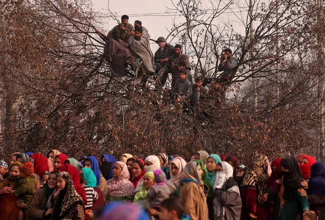 People attend the funeral prayers of Yawar Ahmad, a suspected militant, who according to local media was killed in a gun battle with Indian security forces, at Batnoor village in south Kashmir's Pulwama district November 18, 2018. (Photo by Danish Ismail/Reuters)