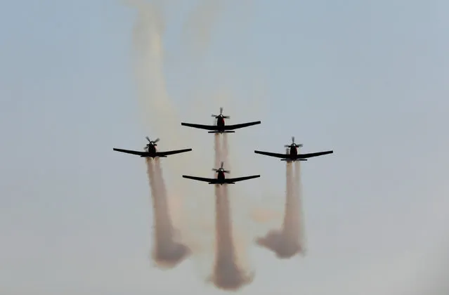 Israeli Air Force T-6 Texan II planes fly in formation during an aerial demonstration at a graduation ceremony for Israeli air force pilots at the Hatzerim air base in southern Israel December 29, 2016. (Photo by Amir Cohen/Reuters)