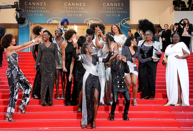 French actresses Nadege Beausson-Diagne, Mata Gabin, Maimouna Gueye, Eye Haidara, Rachel Khan, Aissa Maiga, Sara Martins, Marie-Philomene Nga, Sabine Pakora, Firmine Richard, Sonia Rolland, Magaajyia Silberfeld, Shirley Souagnon, Assa Sylla, Karidja Toure, who collaborated for the publication of the book “Noire n'est pas mon metier” (Black is not my job) and Khadja Nin, member of the Cannes Film Festival Jury pose, at the screening of “Burning” at the Cannes Film Festival, May 16, 2018. (Photo by Jean-Paul Pelissier/Reuters)