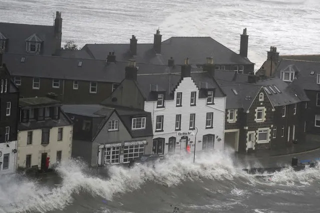 A view of waves, in Stonehaven, Scotland, Thursday, October 19, 2023, as the UK braces for heavy wind and rain from Storm Babet. Hundreds of people are being evacuated from their homes and schools have closed in parts of Scotland, as much of northern Europe braces for stormy weather, heavy rain and gale-force winds from the east. (Photo by Andrew Milligan/PA Wire via AP Photo)