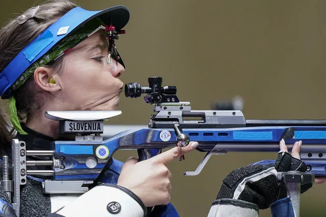 Ziva Dvorsak, of Slovenia, prepares to get her cheek weld as she competes in the women's 50-meter 3 positions rifle at the Asaka Shooting Range in the 2020 Summer Olympics, Saturday, July 31, 2021, in Tokyo, Japan. (Photo by Alex Brandon/AP Photo)