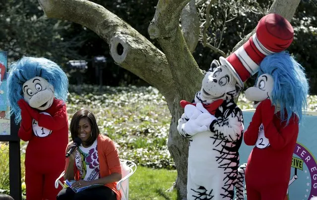 U.S. first lady Michelle Obama (C) reads “Oh, the Things You Can Do That Are Good For You”, a Tish Rabe adaptation of a Dr. Seuss book, to children visiting the White House during the annual Easter Egg Roll in Washington April 6, 2015. (Photo by Gary Cameron/Reuters)