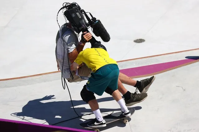 Kieran Woolley of Australia crashes into a cameraman during mens park skateboard at the Olympics at Ariake Urban Park, Tokyo, Japan on August 5, 2021. (Photo by Lisi Niesner/Reuters)