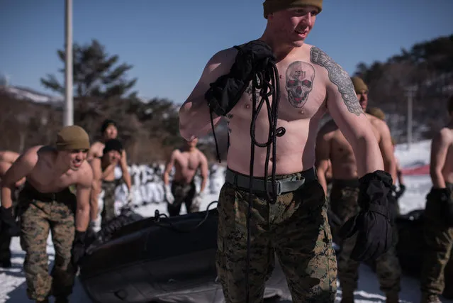 South Korean and US soldiers prepare to perform a demonstation for the media during a joint annual winter exercise in Pyeongchang, some 180 kilometers east of Seoul, on January 24, 2017. The Korean peninsula is the world's last Cold War frontier as Stalinist North Korea and pro-Western South Korea have been technically at war since the 1950-53 conflict. (Photo by Ed Jones/AFP Photo)