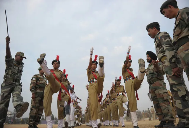 Members of the National Cadet Corps (NCC) prepare for a full dress rehearsal for the Indian Republic Day parade in Secunderabad, the twin city of Hyderabad, on January 24, 2014. India will celebrate its 65th Republic Day on January 26. (Photo by Noah Seelam/AFP Photo)