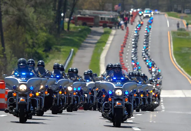 Motorcycles lead a procession for Virginia Trooper Chad P. Dermyer in York Co., Virginia on April 5, 2016. Dermyer was killed in the line of duty at the Richmond Greyhound bus station last week. (Photo by Joe Fudge/The Daily Press via AP Photo)