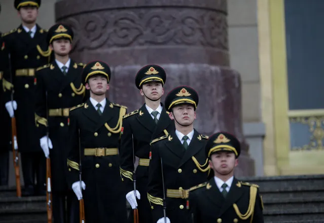 Members of honour guards prepare for a welcoming ceremony for French Prime Minister Bernard Cazeneuve outside the Great Hall of the People in Beijing, China February 21, 2017. (Photo by Jason Lee/Reuters)