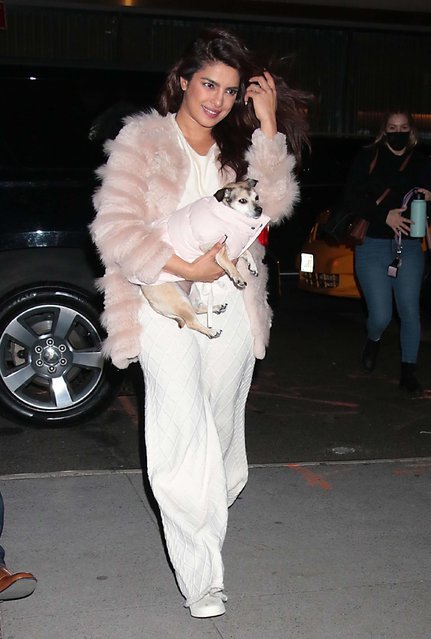 Indian actress Priyanka Chopra cradles her adorable puppy as she steps out in New York City on December 14, 2021 while in town for The Matrix Resurrections press tour. (Photo by MediaPunch/Backgrid USA)
