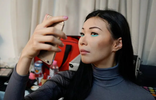 A model checks her make up backstage during Kazakhstan Fashion Week in Almaty, Kazakhstan, April 19, 2016. (Photo by Shamil Zhumatov/Reuters)