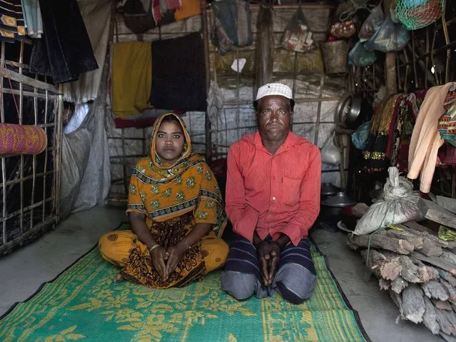 Hamid and his daughter Rajama sit inside their home in the Shamalapur Rohingya refugee settlement in Chittagong district. They fled to Bangladesh from the Dhuachopara village in the Rachidhong district of Myanmar. (Photo by Getty Images/Stringer)