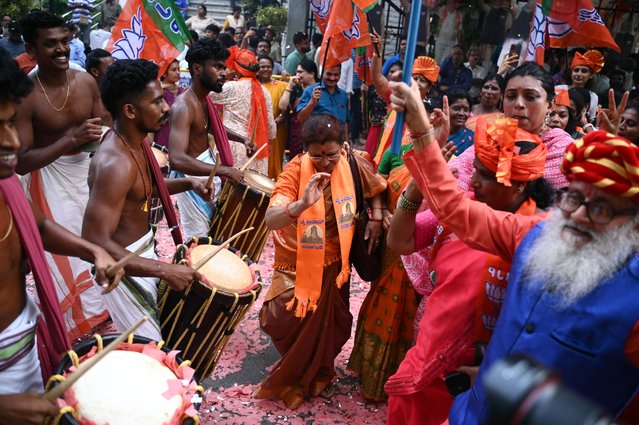 Supporters of Narendra Modi, India's Prime Minister and leader of Bharatiya Janata Party (BJP) celebrate vote counting results for India's general election, in Bengaluru on June 4, 2024. India's Hindu nationalist Prime Minister Narendra Modi and his allies were heading for victory in the country's general election count on June 4, but with a reduced parliamentary majority as the opposition surpassed expectations. (Photo by Idrees Mohammed/AFP Photo)