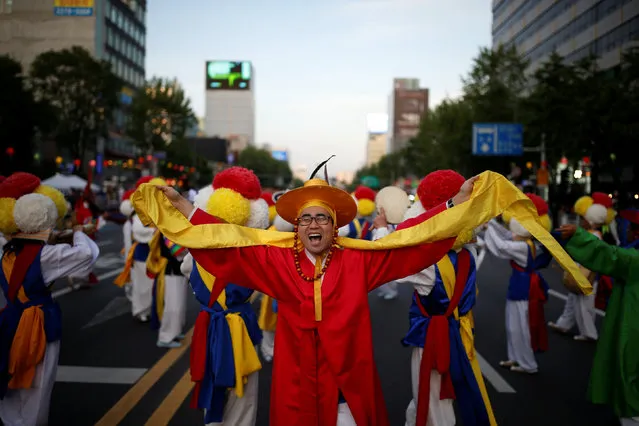 A member of a traditional band performs during a lotus lantern parade in celebration of the upcoming birthday of Buddha in Seoul, South Korea, May 7, 2016. (Photo by Kim Hong-Ji/Reuters)