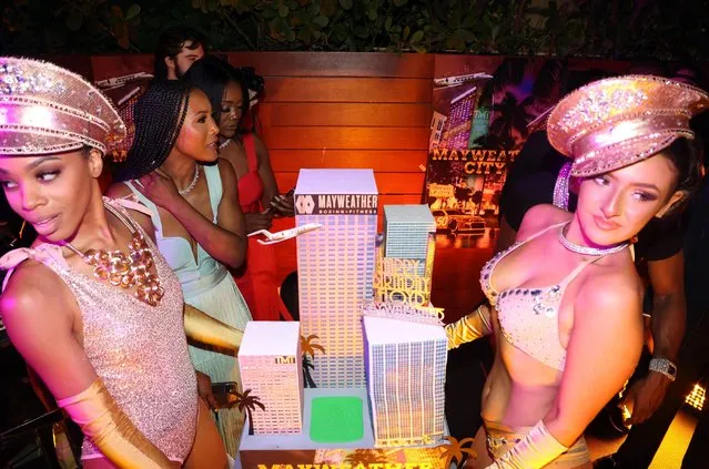 “Mayweather City” cake is held by performers at Floyd Mayweather’s exclusive red carpet birthday bash at Gabriel South Beach on February 24, 2022 in Miami Beach, Florida. (Photo by MediaPunch/Rex Features/Shutterstock)