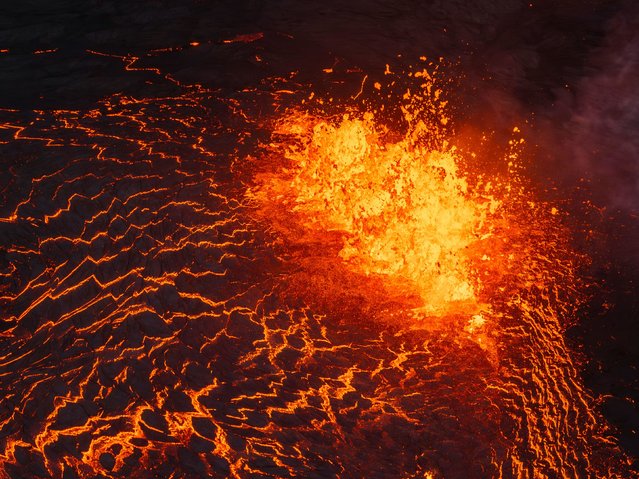 Lava flows from a volcano in Grindavík, Iceland, on Wednesday, May 29, 2024. (Photo by Marco di Marco/AP Photo)