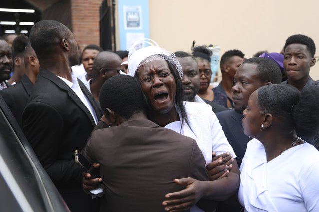 Eunide Majeur Montis, the wife of slain mission director Judes Montis, cries after attending his funeral service in Port-au-Prince, Haiti, Tuesday, May 28, 2024. The service also honored the lives of Davy and Natalie Lloyd, a married couple in their early 20s who were with Montis when gunmen ambushed them on Thursday night, May 23, as they left a youth group activity held at a local church. (Photo by Odelyn Joseph/AP Photo)